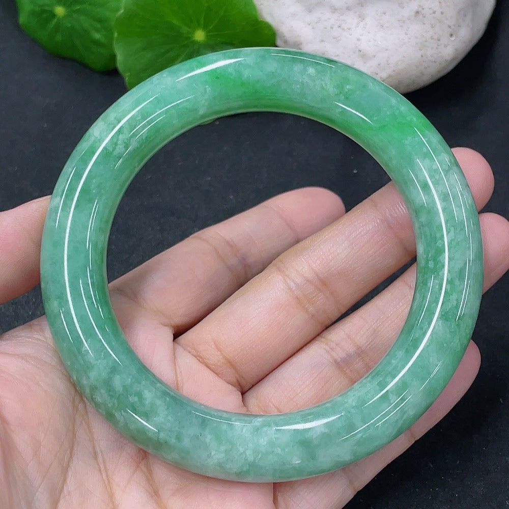 Jadeite round bangle with a 55.5mm diameter, smooth surface, and 76.95g weight, showcasing vibrant green jade color.
