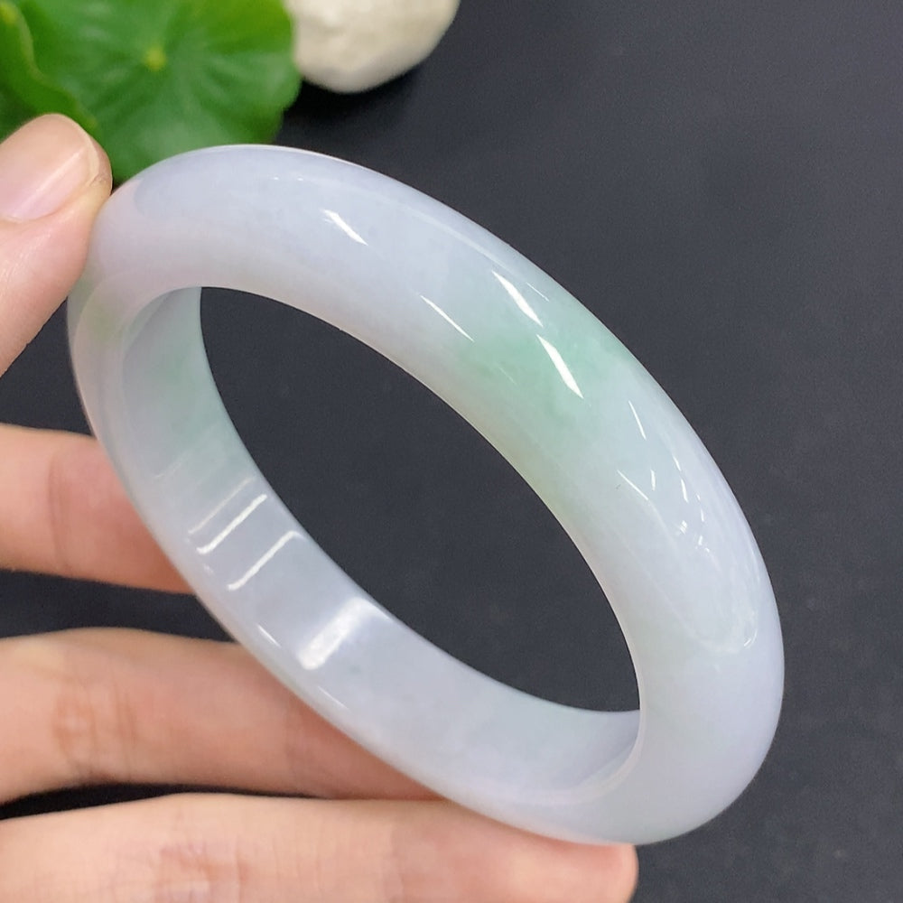 Jadeite round bangle with size 58.7 and approx. 68.3g weight, crafted by HKHQ, showcasing smooth, polished jade surface.