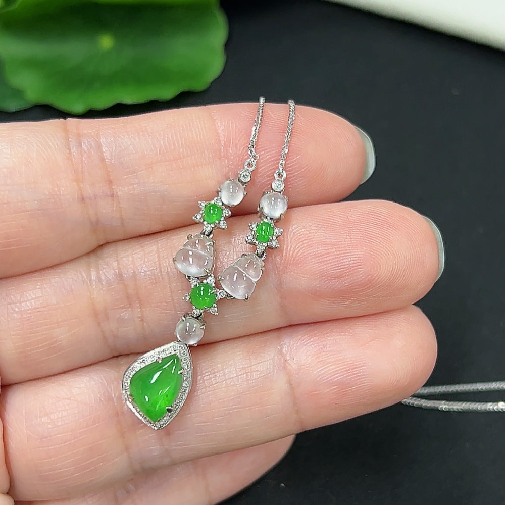 Jadeite necklace with diamond accents in 18K gold, weight 3.6g, featuring polished jade stones on a delicate gold chain.