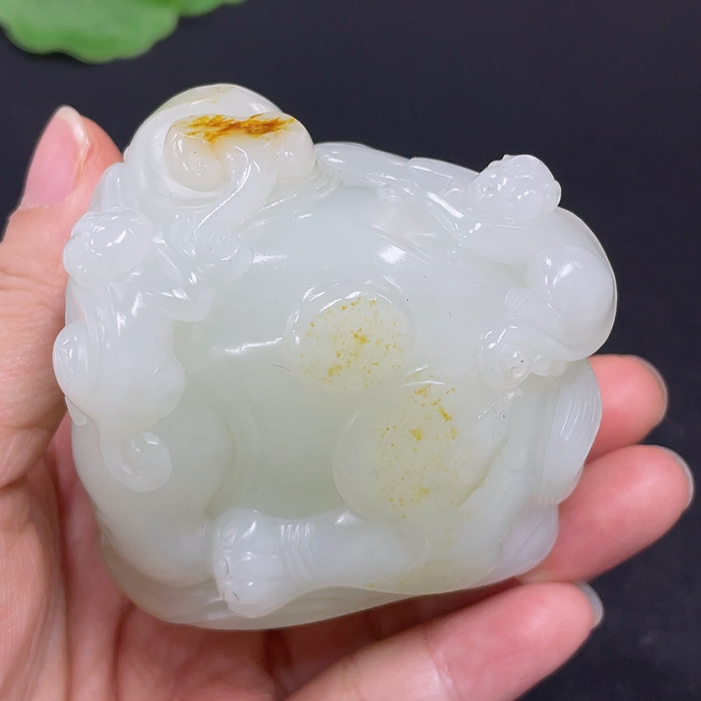 HKHQ Hetian jade handheld carving depicting the phrase "Attaining High Rank and Position," showcasing detailed jade craftsmanship.