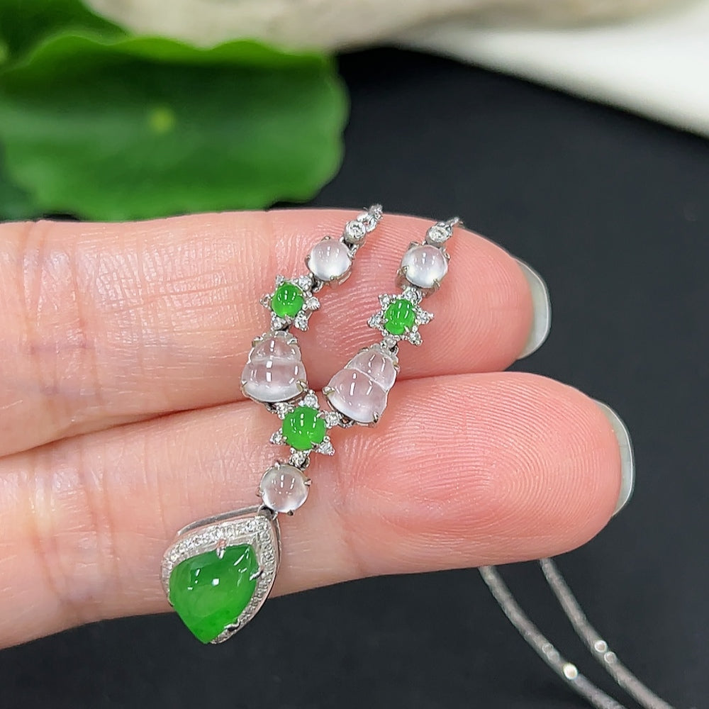 Elegant jadeite necklace in 18K gold with diamond accents, featuring smooth jade stones and a refined clasp design.