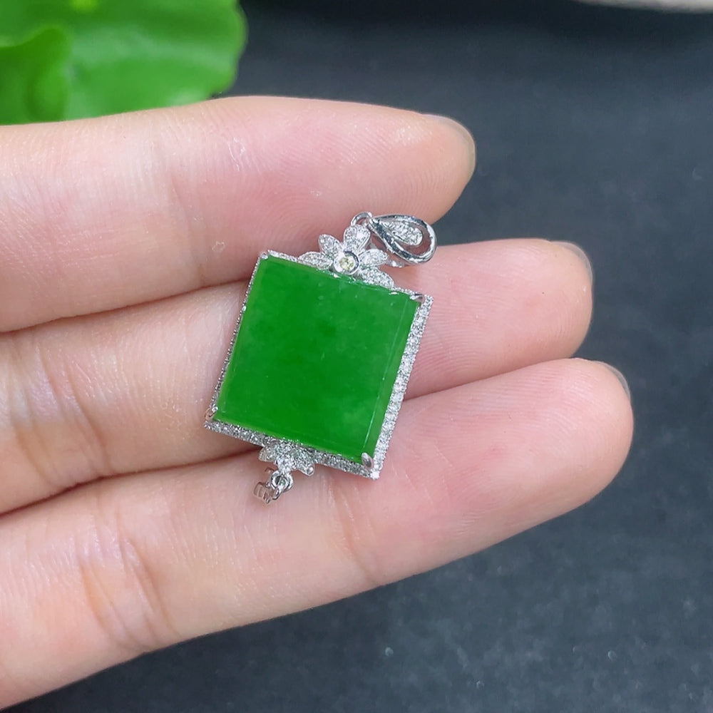 Jadeite pendant with 18k gold and diamond accents, showcasing a polished green jade stone on a delicate necklace.