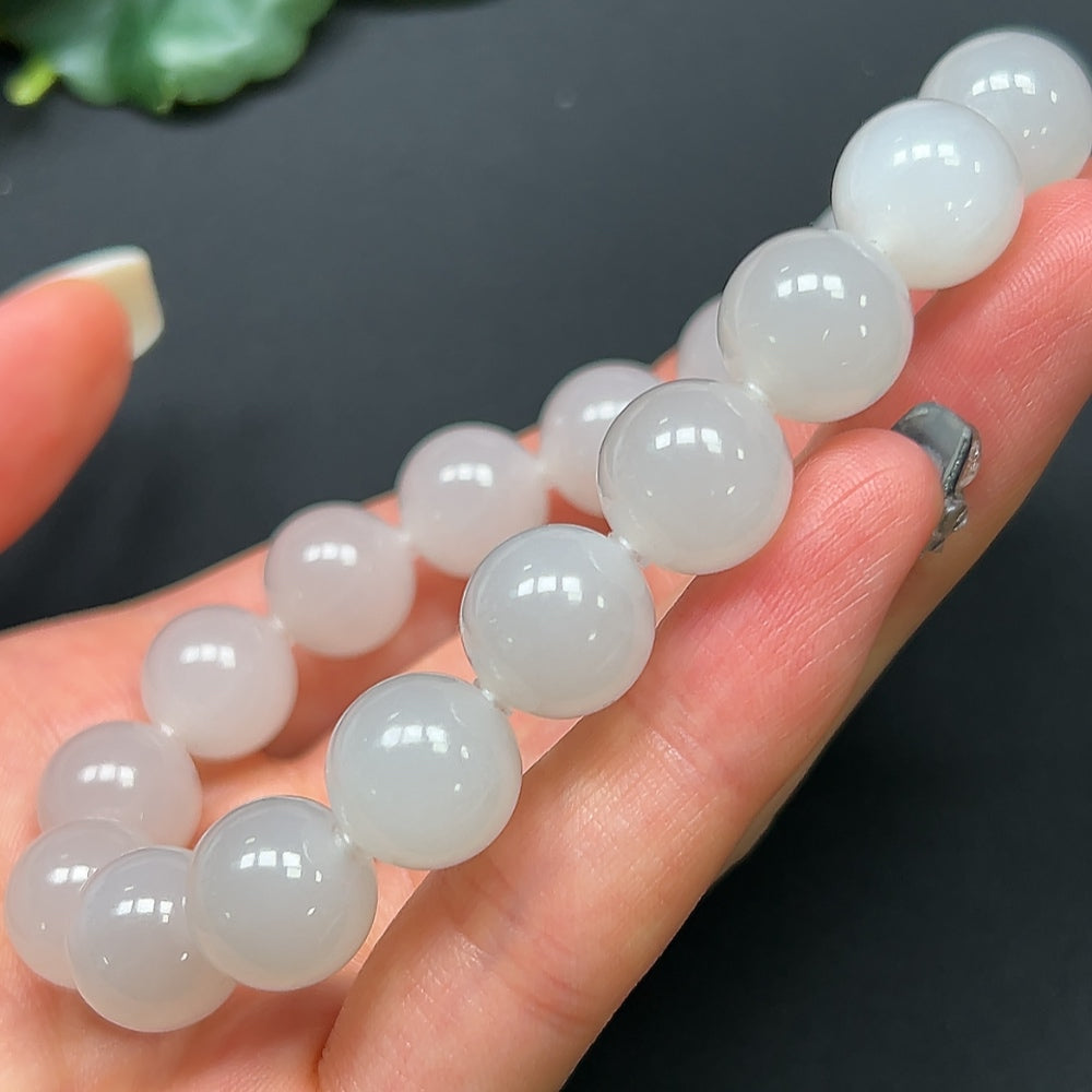 HKHQ Hetian Jade bracelet with 11.9mm beads, approximately 44.52g, featuring smooth, polished green jade stones.