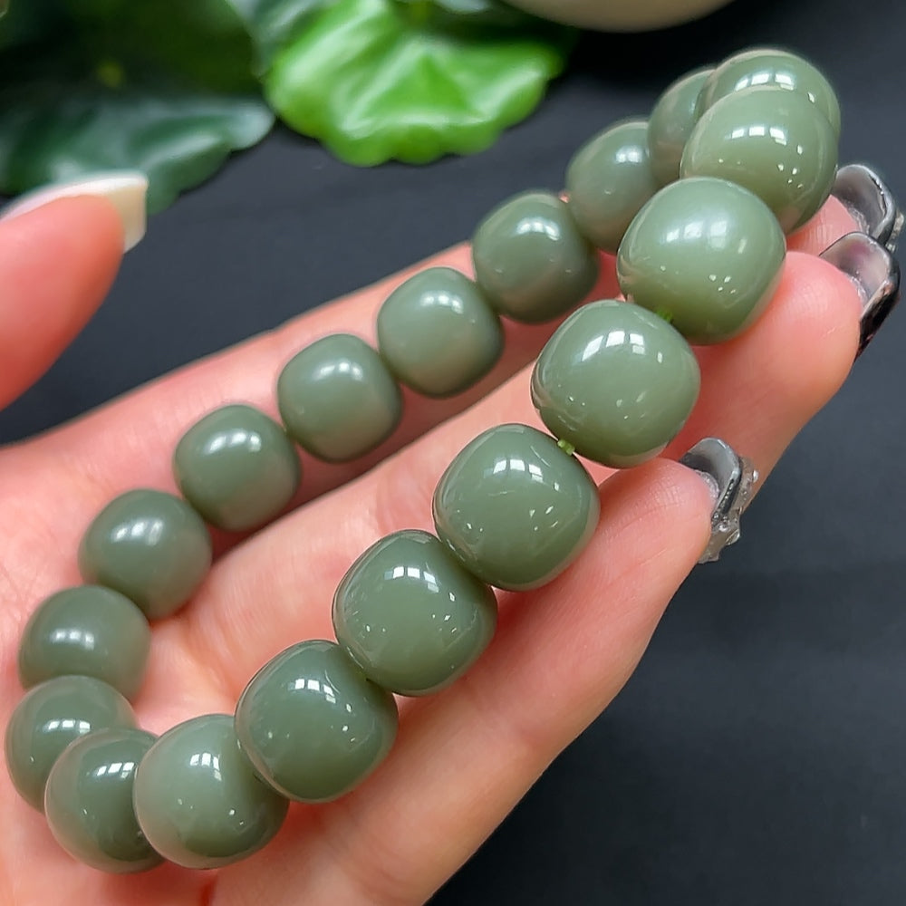 HKHQ Hetian Jade bracelet with 11.8mm beads, weighing approximately 49.28g, showcasing smooth, polished jade stones.