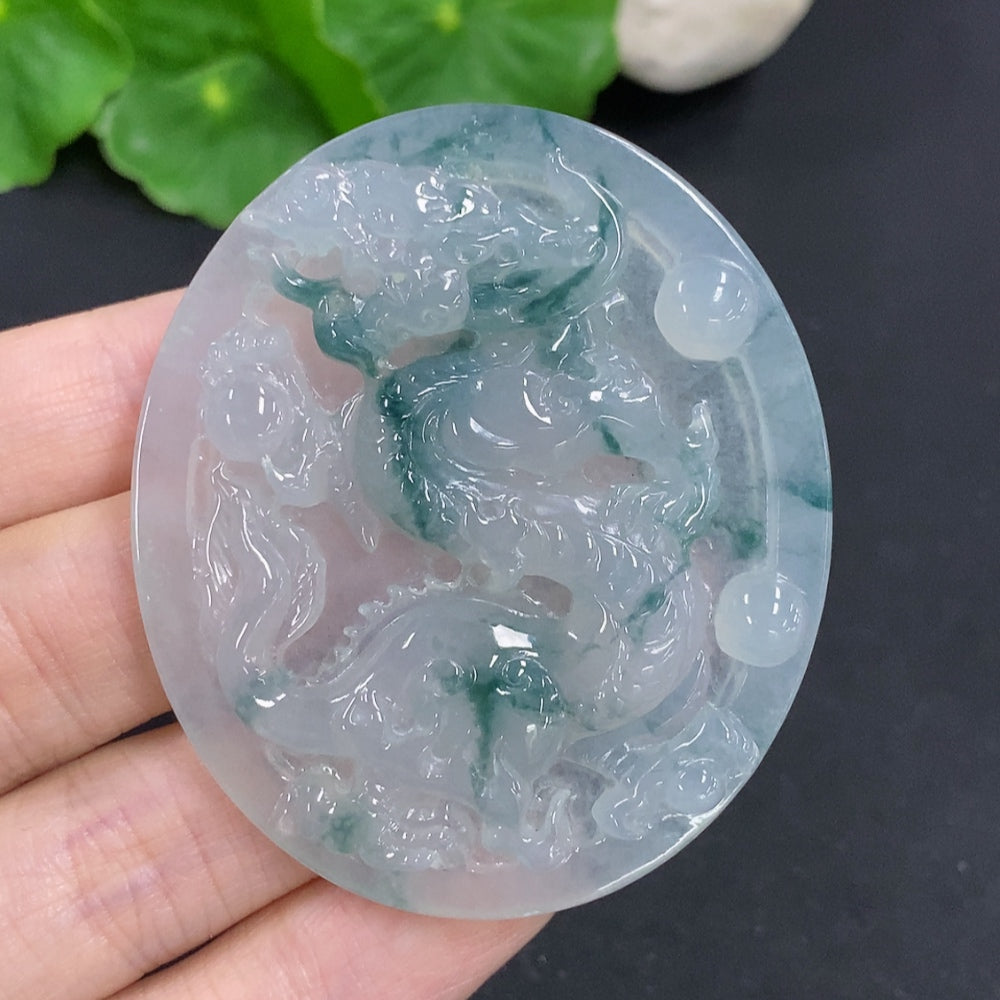 Jadeite dragon pendant necklace from HKHQ, featuring a detailed green jadeite dragon design on a silver chain.