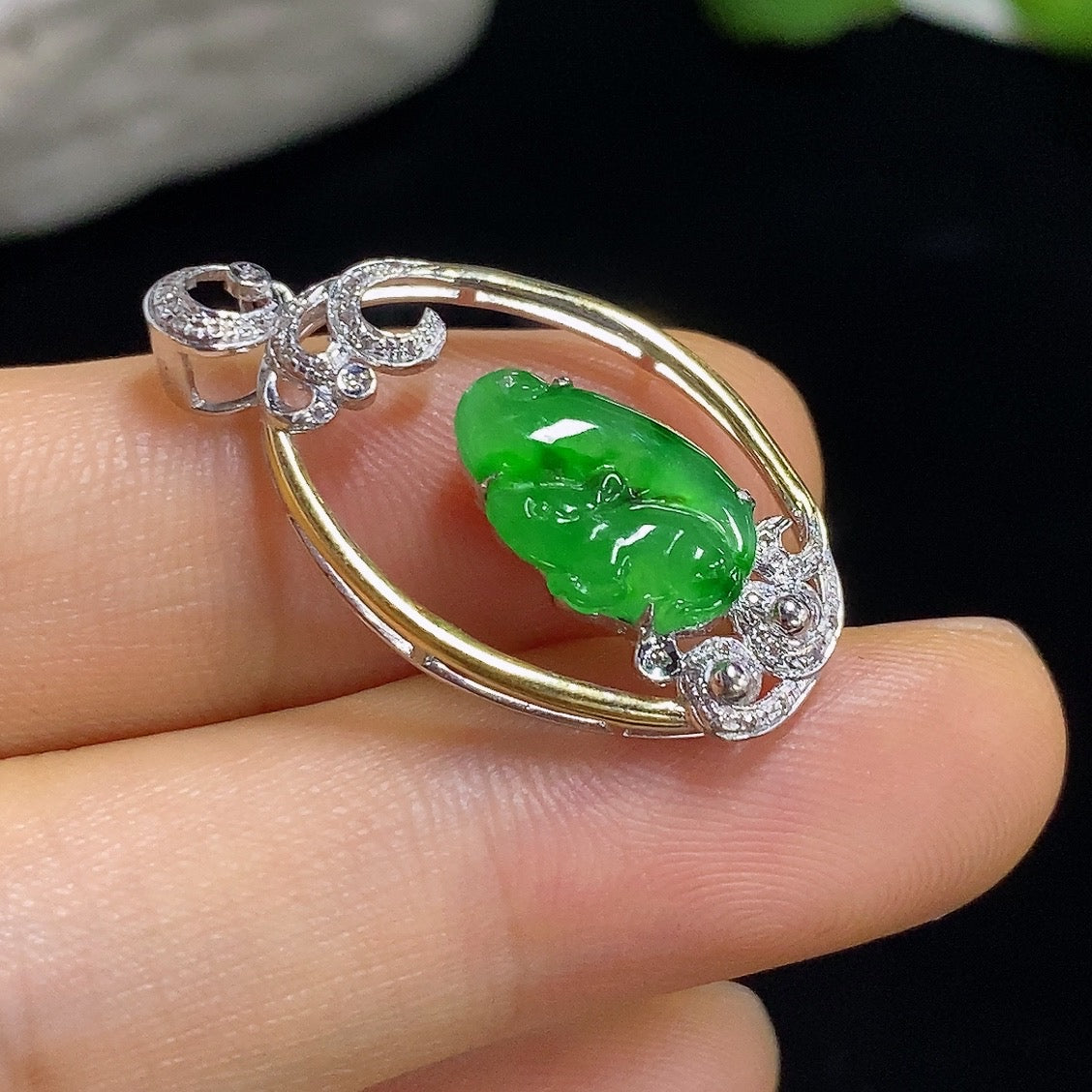 Jadeite inlaid pendant with 18k gold and diamond accents, featuring a delicate jade pendant with intricate inlay work.