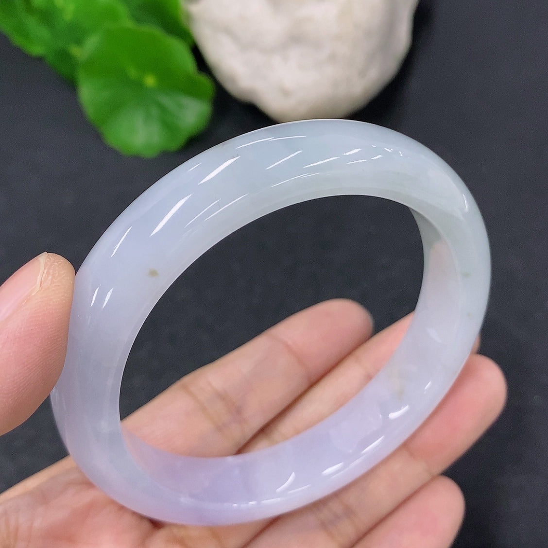 HKHQ jadeite round bangle with 53.8mm diameter, smooth surface, and 49.63g weight, showcased on a neutral background.