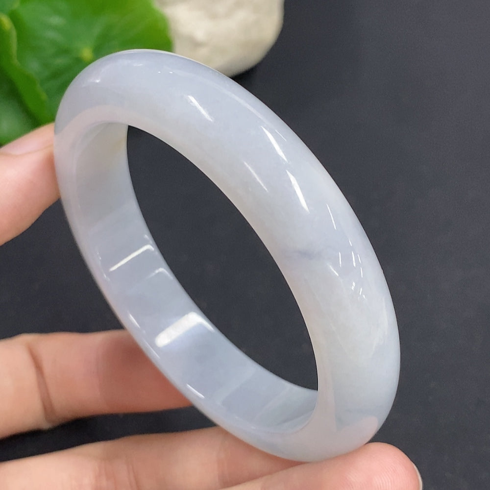 HKHQ jadeite round bangle, size 54, 51.5g, showcasing smooth, polished green jadeite bracelet on a neutral background.