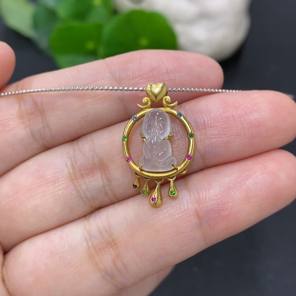 Jadeite inlaid pendant with 18K gold rope setting, featuring smooth green jade stone and intricate gold detailing.