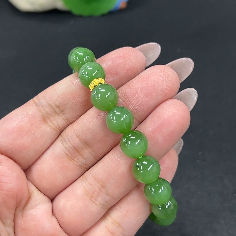 HKHQ Hetian jade bracelet with 9.6mm beads, weighs approximately 30.1g, showcasing smooth green jade stones.