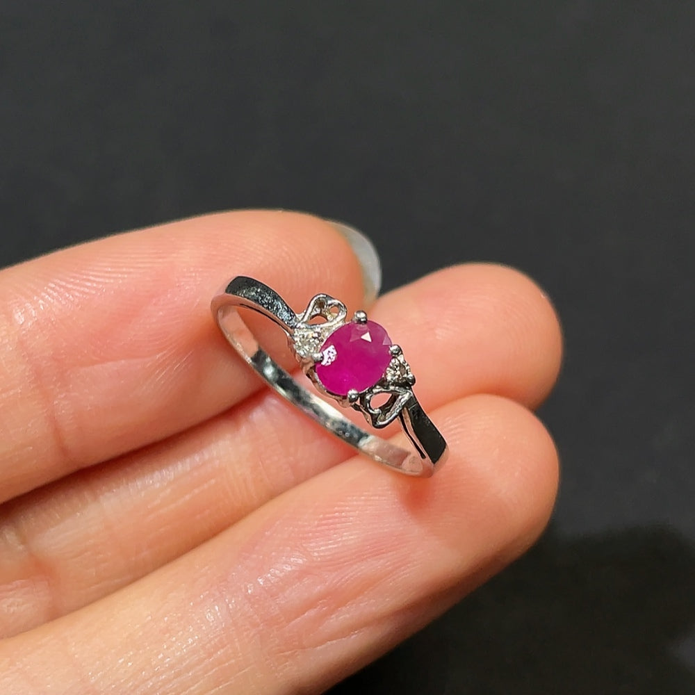 HKHQ ruby ring with diamond accents, platinum 87%, size 14, featuring a vibrant ruby gemstone and sparkling diamond details.