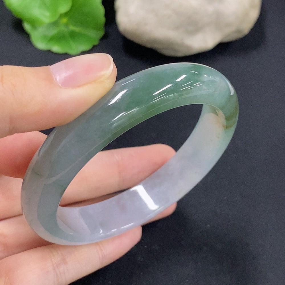 HKHQ Jadeite round bracelet, size 57.9, repaired, weighing approximately 55.38g, featuring smooth, polished jade stones.
