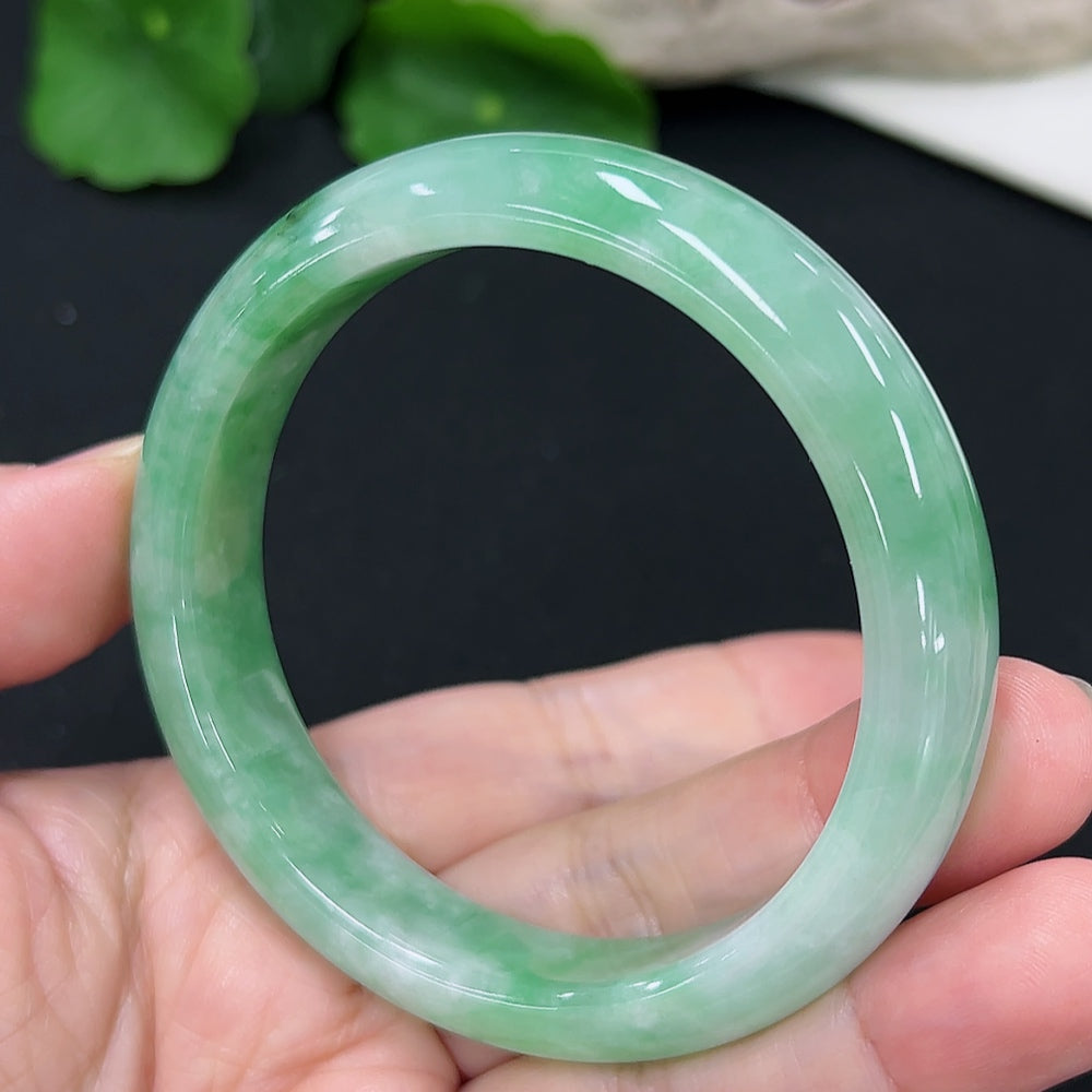 Jadeite round bangle in size 55.1 with approximately 50.4g weight, showcasing smooth, polished jadeite from HKHQ.