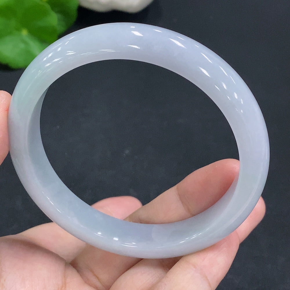 Huiliu Certified Jadeite round bracelet by HKHQ featuring smooth, polished green jade beads on a delicate string.