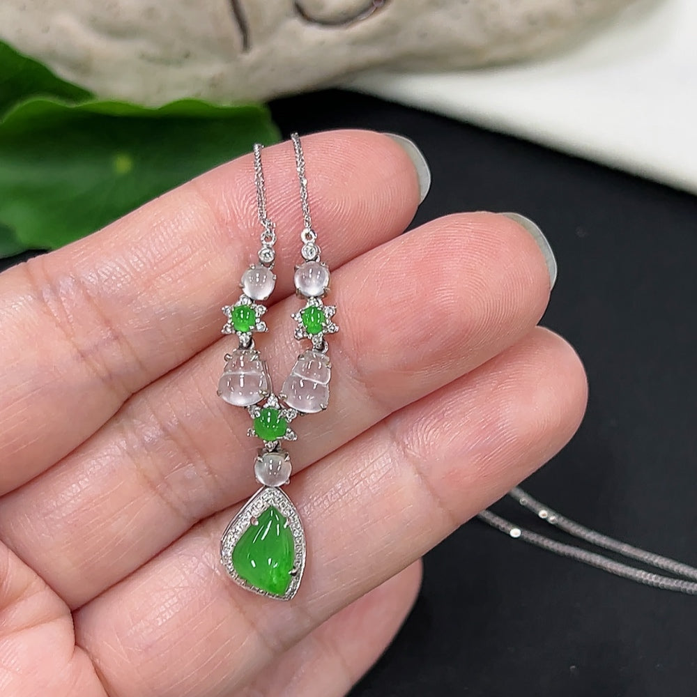 Elegant jadeite necklace with diamond accents in 18K gold, showcasing smooth green jade beads and delicate gold links.