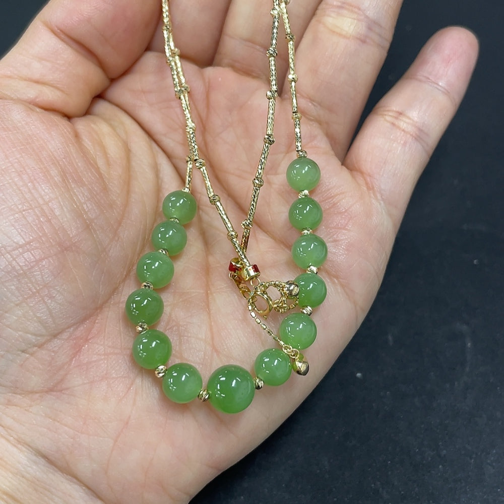 Hetian jade jasper bead necklace with 18k gold accents, 5.9mm beads, marked in red, total weight 6.1g, by HKHQ.