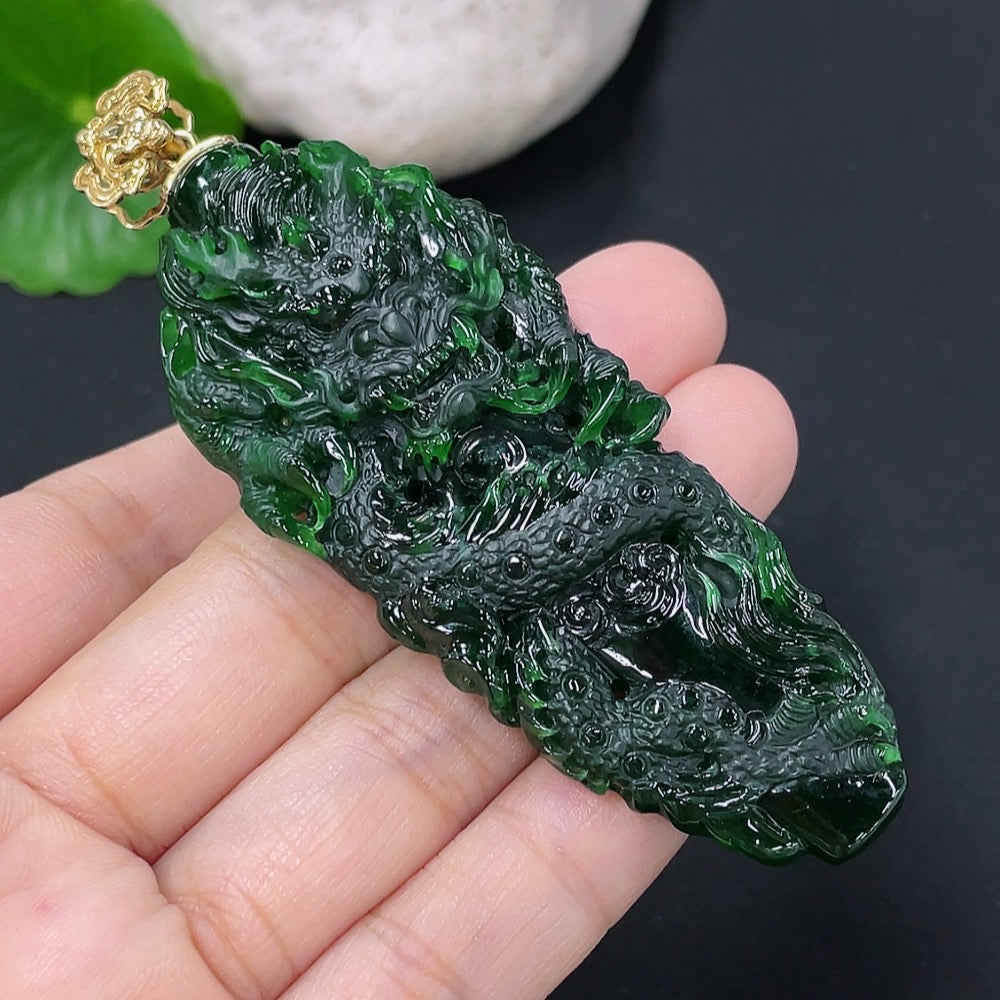 Jadeite pendant featuring a carved dragon plaque in green jade, 18K gold setting, from HKHQ.