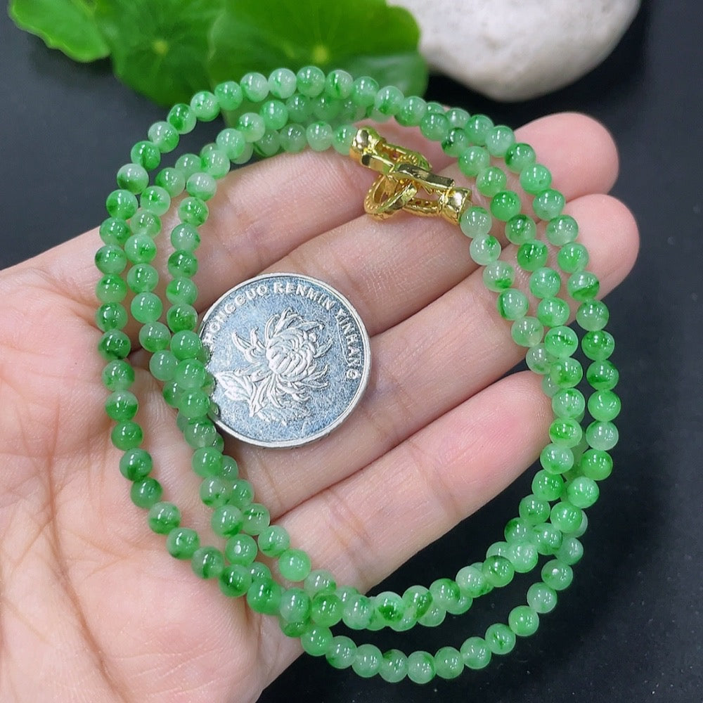 Jadeite bead necklace featuring natural mineral components, non-gold jewelry from HKHQ with smooth, polished jadeite beads.