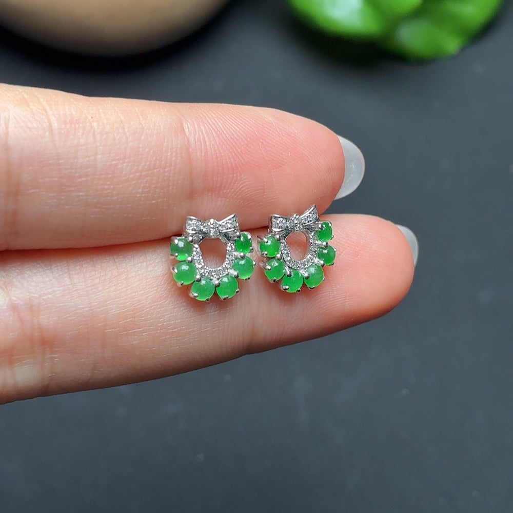 Jadeite earrings with diamond accents in 18k gold, featuring intricate design and a total weight of approximately 2 grams.