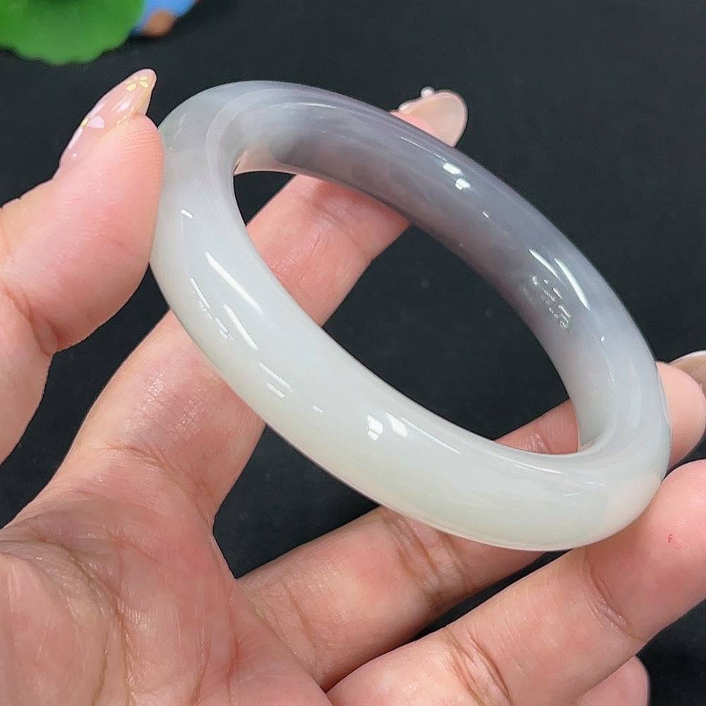 Huiliu certified Hetian Jade round bracelet featuring smooth, polished jade beads in a natural light green hue.