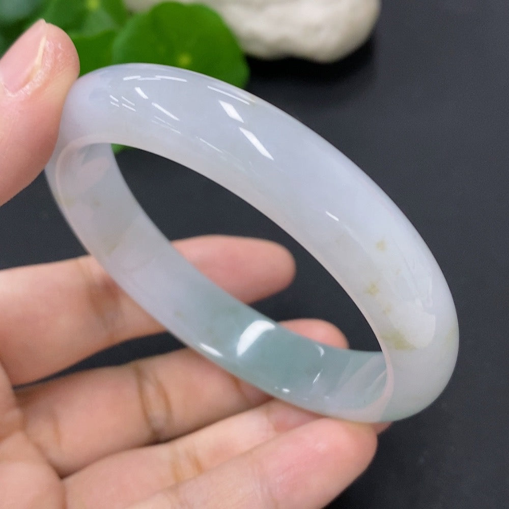 Jadeite round bangle with a total weight of 53g and size 58.7, featuring smooth, polished jadeite in natural green tones.