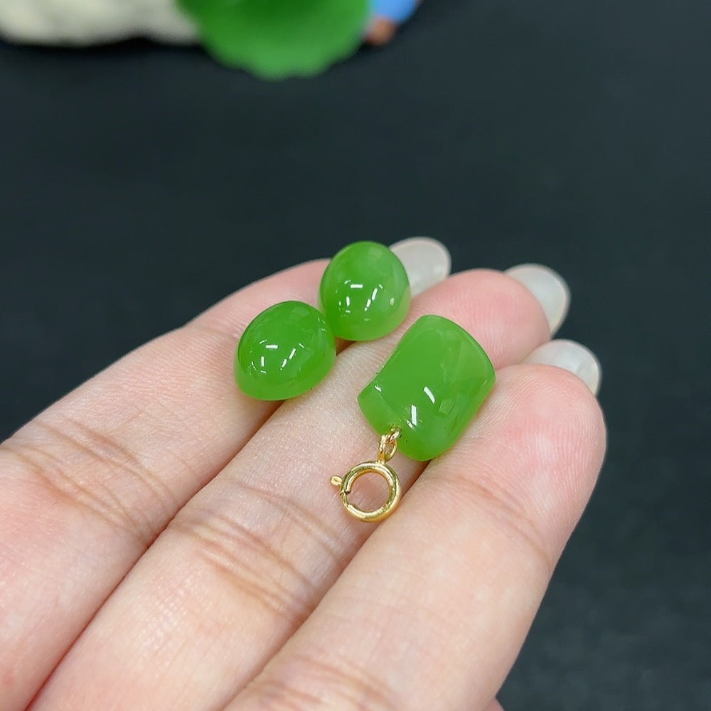 HKHQ Hetian jade inlaid pendant and earrings set featuring 18K gold craftsmanship, shown with detailed jade and gold design.