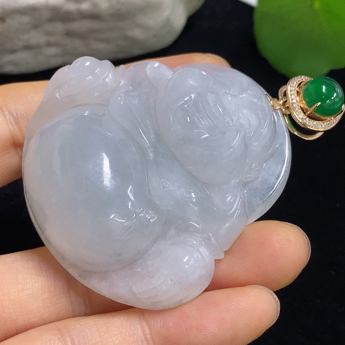 Jadeite Buddha pendant necklace with 18K gold and diamond accents, featuring a green cabochon jadeite stone.