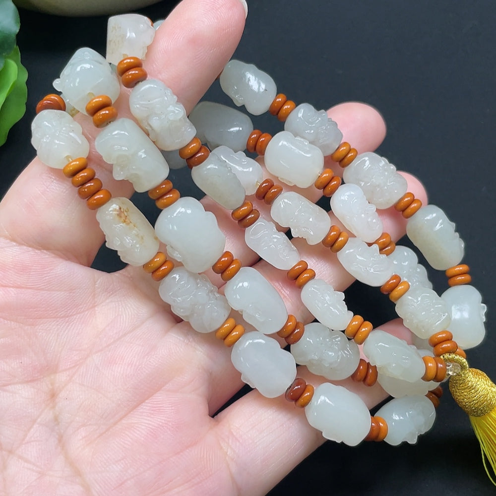 Hetian Jade Eighteen Arhats bracelet with beaded string, HKHQ brand, weighs approx. 65.71g, colorful beads, detailed craftsmanship.