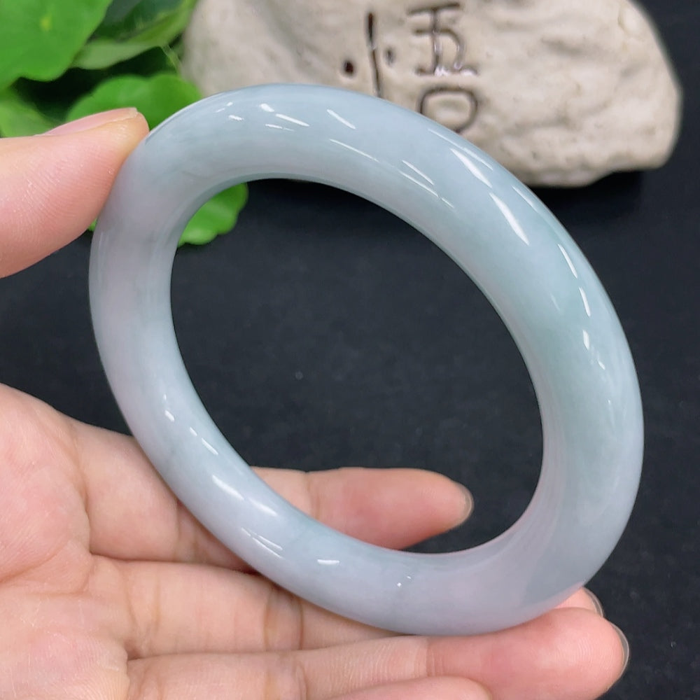 Jadeite round bangle with a size of 57.4mm and weight of 65.9g, featuring smooth, polished jadeite stones on a jewelry piece.